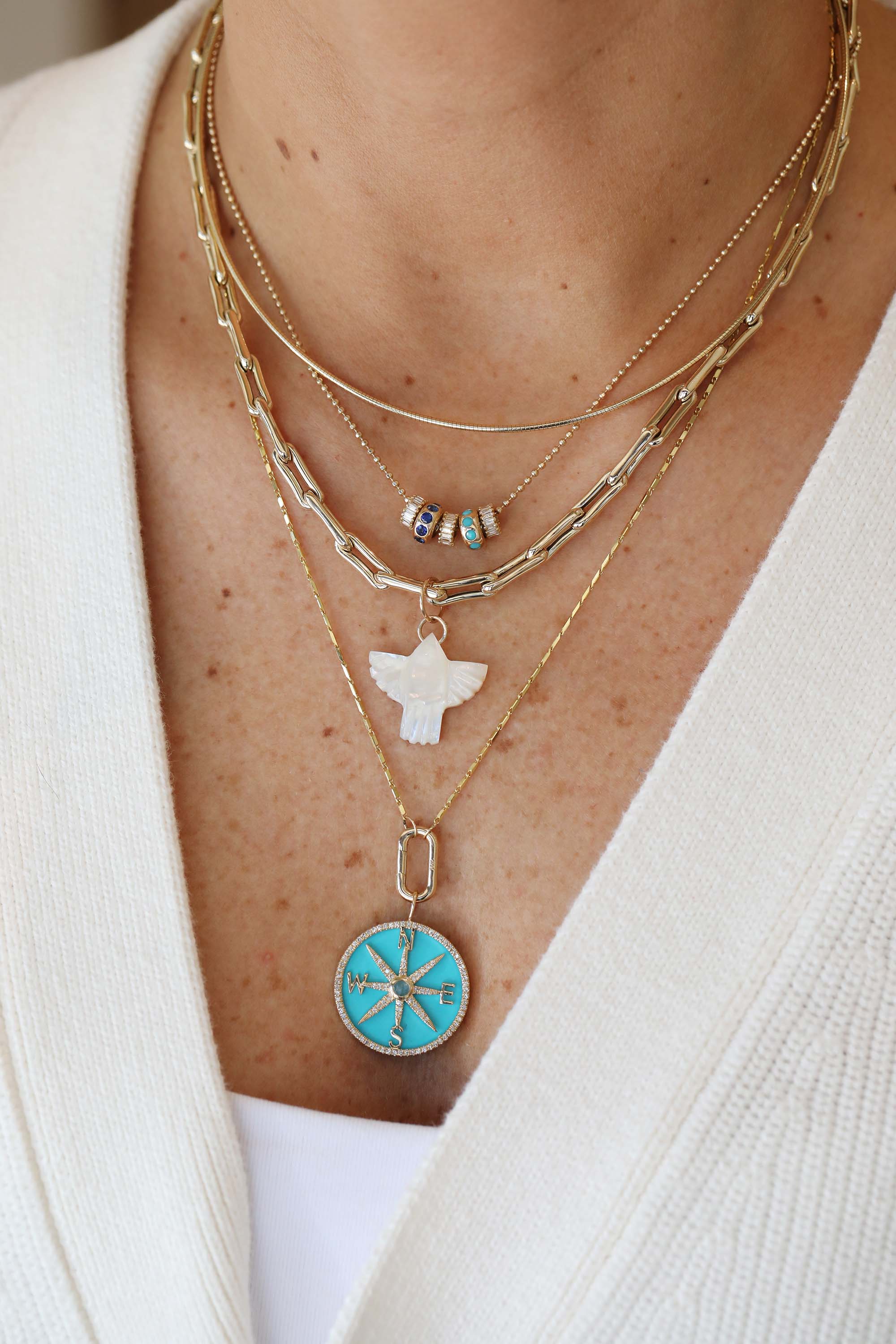 Small 14K Gold Carved Mother of Pearl Thunderbird Charm